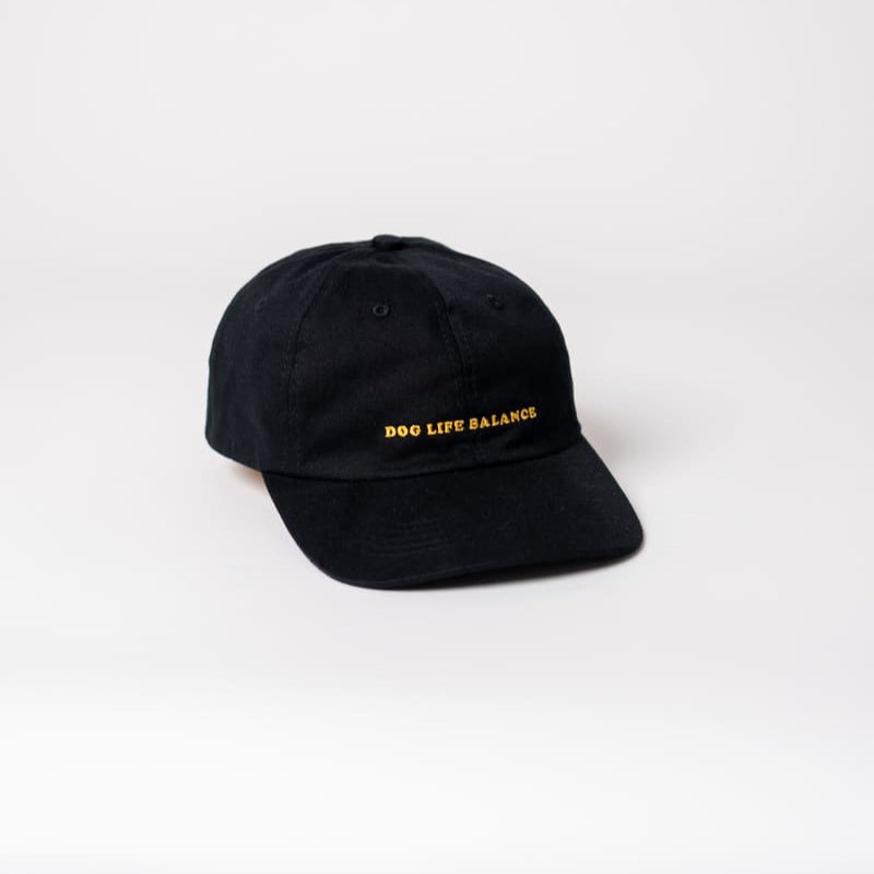 Dog life balance organic cap von arrel in schwarz mit orangener Schrift