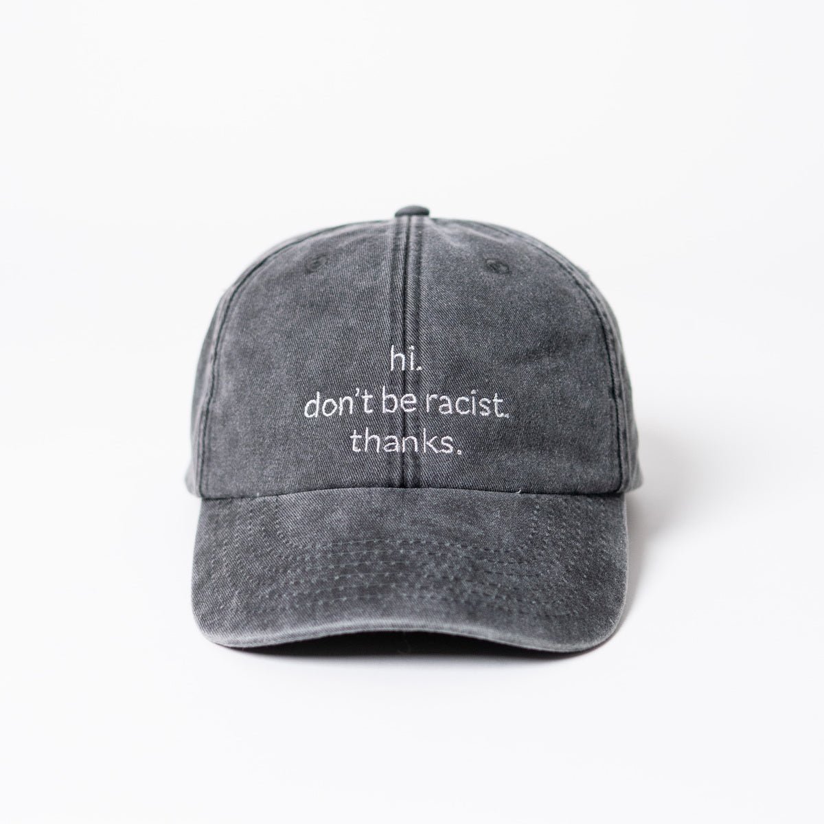 hi. don't be racist. thanks. dad cap in vintage black von arrel